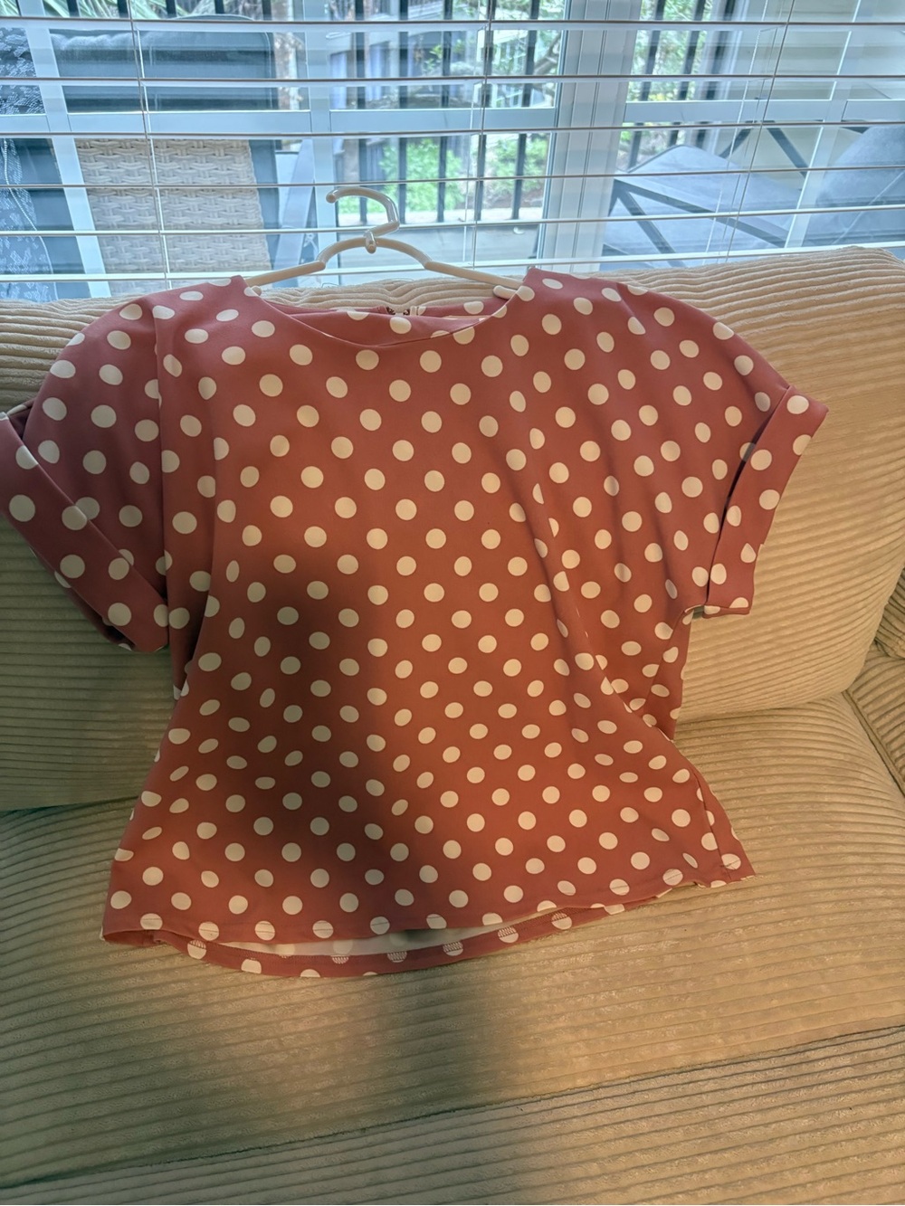 Pink and white polka dot blouse